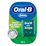 Green Oral‑B Glide Scope mint floss plastic case shown on branded card with micro‑textured callout