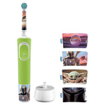 Green Oral‑B kids toothbrush with Mandalorian stickers alongside white charger base and four character sticker strips