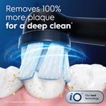Close-up rendering of an Oral‑B iO round brush head cleaning a tooth with motion and plaque removal effects
