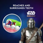 Graphic showing toothbrush bristles reaching and surrounding teeth next to The Mandalorian branding and character image