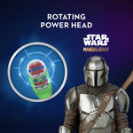 Illustration of a rotating toothbrush power head with The Mandalorian logo and character on a blue background