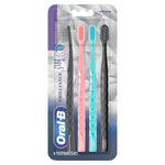 Back of Oral-B Brilliance toothbrush blister card showing product claims, icons and barcode