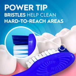 Oral-B toothbrush head close-up with magnified inset showing blue power tip bristles reaching hard-to-reach areas