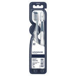 Rear view of Oral-B two-pack blister packaging showing the backs of two manual toothbrushes and labeling