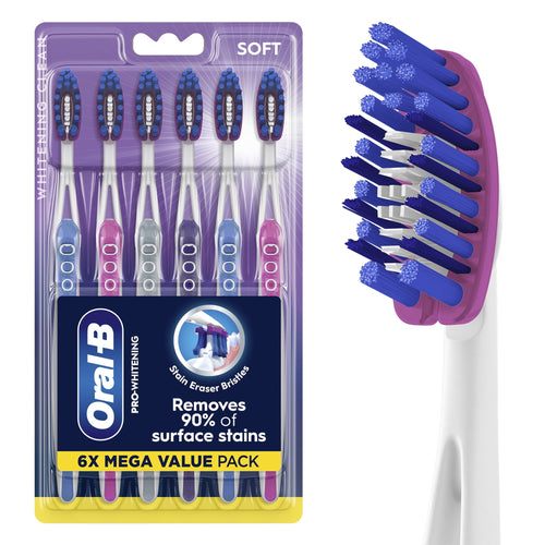 Packaged Oral‑B Pro‑Whitening soft toothbrushes six‑pack with visible blue and purple stain‑eraser bristles in retail blister card.