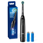 Black Oral‑B ProClean battery toothbrush standing next to its blue retail box and two AA batteries on white background.
