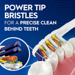 Detailed render of toothbrush power-tip bristles cleaning behind teeth with magnified inset showing bristle layers