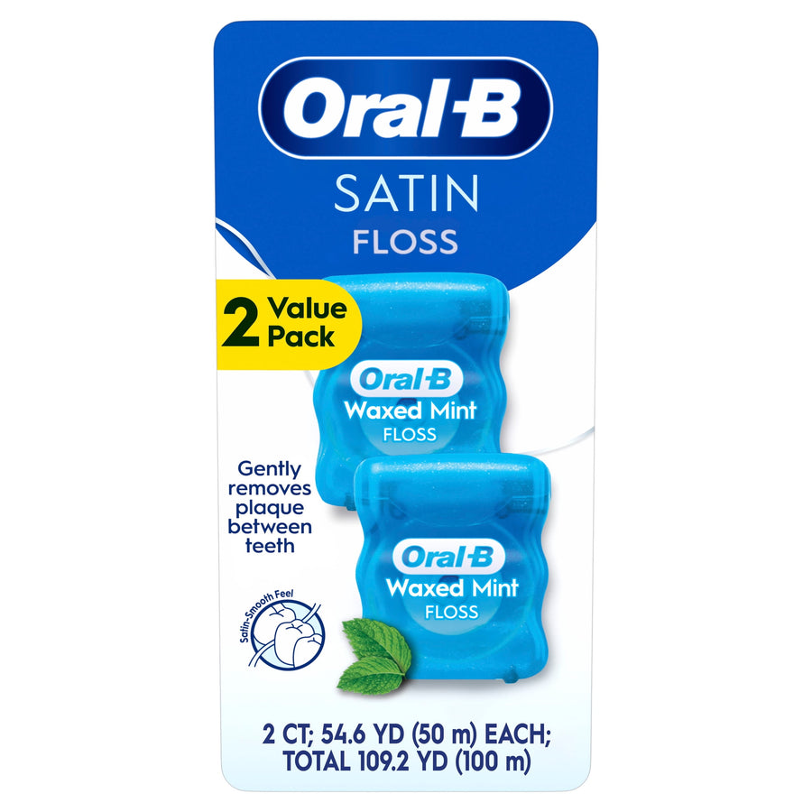 Oral‑B Satin Waxed Mint dental floss twin-pack on white retail card with mint leaf and product text