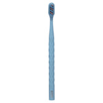 Sky-blue Oral-B toothbrush photographed upright on white background showing textured handle and bristles