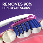 Closeup illustration of an Oral‑B toothbrush head brushing stained teeth with headline text claiming it removes 90% of surface stains.