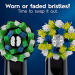 Close-up comparison of worn and new Oral‑B round brush heads with text prompting replacement of faded bristles.