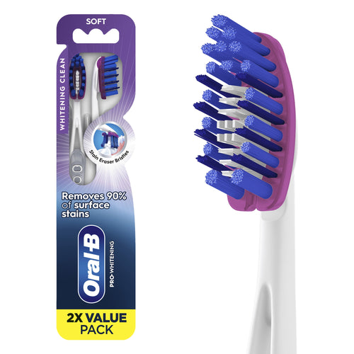Oral-B Pro-Whitening toothbrush 2-pack in purple-blue packaging showing two soft-bristle toothbrushes and brand logo