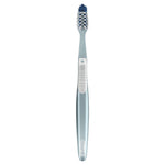 Single Oral-B manual toothbrush shown upright on a white background with blue handle and angled cross-action bristles