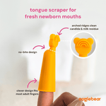 Close-up of an orange silicone tongue scraper on an adult finger with callouts pointing to no-bite design and arched ridges for cleaning.