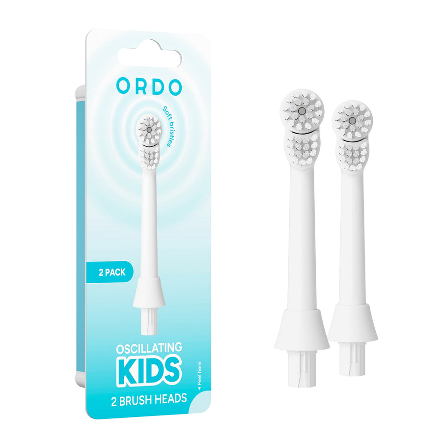 Ordo branded blue blister packaging beside two white oscillating kids toothbrush replacement heads on a white background.