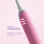 Angled close-up of the pink toothbrush body with three progress lights and text art indicating tracked brushing progress.