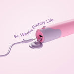 Pink toothbrush base with a USB-C cable plugged into its port and text indicating extended battery life in the artwork.