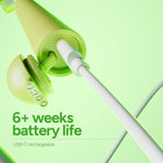 Angled view of the lime Ordo toothbrush plugged into a USB-C cable highlighting the charging port and cap.