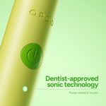 Close-up of the lime Ordo Sonic Edge toothbrush body showing embossed logo, power button and an illuminated indicator.