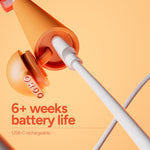 Ordo Sonic Edge peach toothbrush shown with USB-C cable plugged into charging port and battery claim
