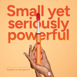Hand holding an Ordo Sonic Edge peach toothbrush against an orange background with bold text