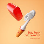 Floating Ordo Sonic Edge peach toothbrush head and red travel cap against a peach background