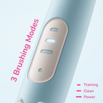 Close-up of the Ordo Sonic Kids toothbrush handle showing three illuminated brushing mode indicators and pink accent.