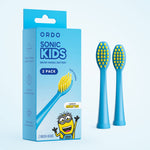 Product shot of Ordo Sonic Kids Minions blue replacement brush heads shown beside the branded blue box packaging and two brush heads.