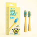 Product pack shot of ORDO Sonic Kids Minions yellow 2-pack brush heads alongside two yellow replacement brush heads with blue bristles.