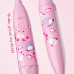 Close-up of two pink Ordo kids toothbrush handles decorated with Squishmallows Auggie character illustrations