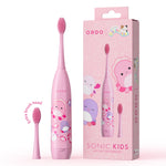 Pink Ordo kids sonic toothbrush with Squishmallows Auggie characters shown next to matching product box and extra brush head
