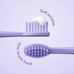 Two purple brush heads shown: a side profile with toothpaste and a top view showing slim soft bristles