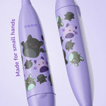 Close-up of two purple Ordo Sonic Kids toothbrush handles decorated with Squishmallows Emily characters