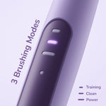 Close-up of the Ordo toothbrush control panel showing three brushing mode indicators with one lit