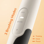 Close-up of the Ordo toothbrush handle showing three illuminated brushing-mode indicator lights and textured grip