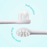 Close-up profile and top views of a slim white toothbrush head with soft bristles and teal callouts