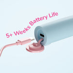Close-up of the toothbrush base with USB-C charging cable inserted and copy claiming 5+ weeks battery life.