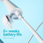 Detail view of Ordo toothbrush USB-C charging cable connected to the base and magnetic charger puck with product text