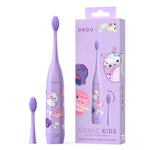 Product shot of purple Ordo kids sonic toothbrush, extra brush head and retail box featuring Squishmallows Daxxon artwork