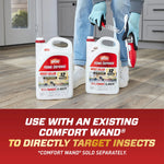 Lifestyle image of two Ortho Home Defense refill jugs on a floor with a person holding a comfort wand device in background