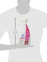 Scale illustration of a person holding an OUT! Oxy-Fast spray bottle with 11 in / 28 cm height measurement