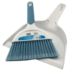 Overhead view of a white dustpan and blue-bristled hand broom nested together on a plain background