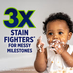 Baby with messy face and bold text advertising 3x stain fighters for messy milestones alongside OxiClean branding