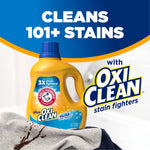 Arm & Hammer plus OxiClean bottle with bold headline claiming it cleans 101+ stains and spilled stain on fabric