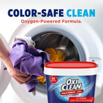 Lifestyle image of hands loading colorful laundry into a front-load washer with OxiClean tub and 'COLOR-SAFE CLEAN' header