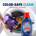 Image of OxiClean Max Force bottle in front of a washing machine with hands holding colorful laundry, labeled color-safe clean