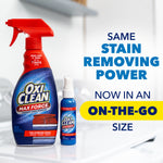 OxiClean Max Force trigger spray bottle and a small travel spray displayed on a countertop with text promoting on-the-go stain removing power