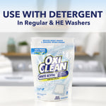 OxiClean White Revive pouch displayed on a countertop with overlay text: 'Use with detergent in Regular & HE washers'