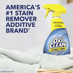 OxiClean spray bottle placed on folded towels with text 'America's #1 Stain Remover Additive Brand' beside it.