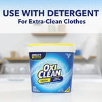 OxiClean tub placed in a laundry room scene under headline 'Use with detergent for extra-clean clothes'
